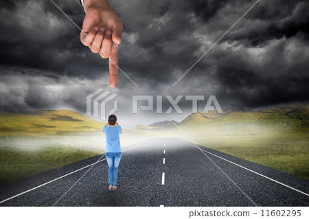 Giant hand pointing at pretty brunette shouting Giant hand pointing at pretty brunette shouting 11602295