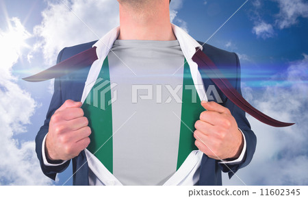 Composite image of businessman opening shirt to reveal nigeria f Composite image of businessman opening shirt to reveal nigeria f 11602345