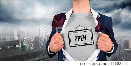 Composite image of businessman opening shirt in superhero style 11602351