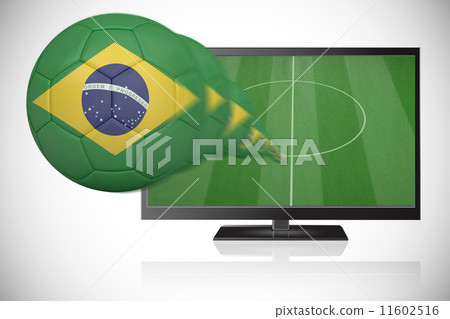 Composite image of football in brasil colours flying out of tv Composite image of football in brasil colours flying out of tv 11602516