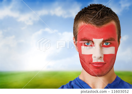 Composite image of swiss football fan in face paint Composite image of swiss football fan in face paint 11603052