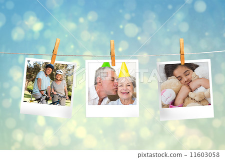 Composite image of instant photos hanging on a line Composite image of instant photos hanging on a line 11603058
