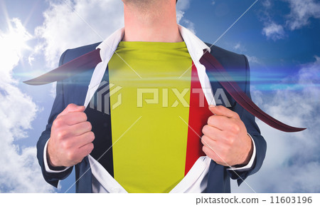 Composite image of businessman opening shirt to reveal belgium f Composite image of businessman opening shirt to reveal belgium f 11603196
