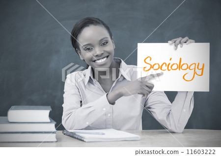 Happy teacher holding page showing sociology Happy teacher holding page showing sociology 11603222