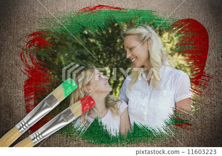 Composite image of mother and daughter in the park 11603223