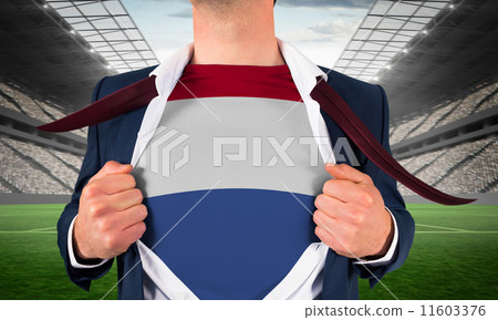 Composite image of businessman opening shirt to reveal netherlan Composite image of businessman opening shirt to reveal netherlan 11603376