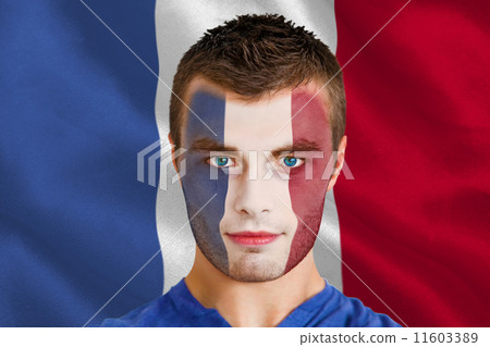 Composite image of serious young france fan with facepaint Composite image of serious young france fan with facepaint 11603389