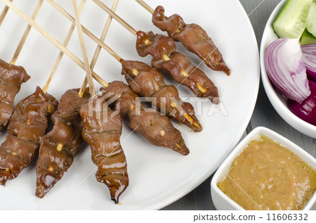 Duck Satay served with peanut sauce, red onions and cucumber. Duck Satay served with peanut sauce, red onions and cucumber. 11606332