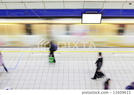 people walking on platform at metro station 11609615