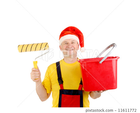 Worker in santa's hat with bucket. Worker in santa's hat with bucket. 11611772
