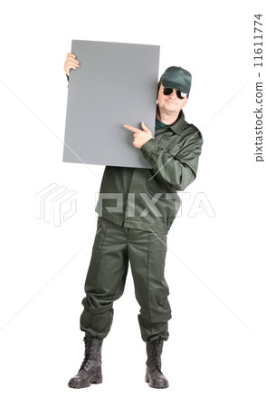 Man in workwear stands with board. Man in workwear stands with board. 11611774