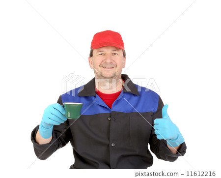 Man in workwear with a cup of coffee. Man in workwear with a cup of coffee. 11612216