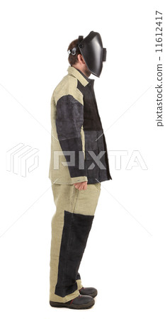 Welder in workwear suit. Side Welder in workwear suit. Side 11612417