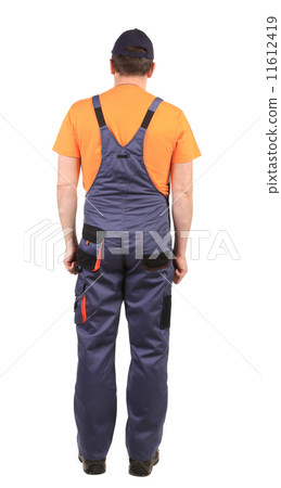 Worker wearing overalls. Worker wearing overalls. 11612419