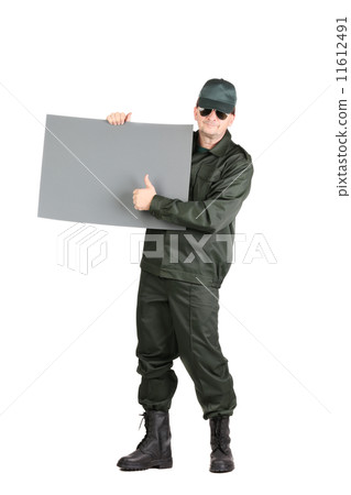 Man in workwear stands with paper. Man in workwear stands with paper. 11612491