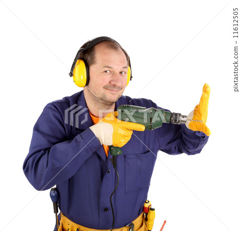 Man in workwear and headphones with a drill 11612505