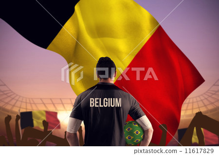 Composite image of belgium football player holding ball 11617829