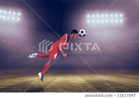 Composite image of football player in red jumping Composite image of football player in red jumping 11617847