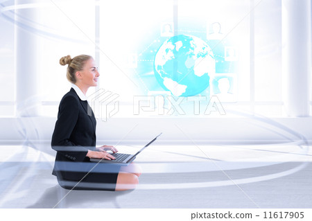 Composite image of businesswoman using laptop 11617905