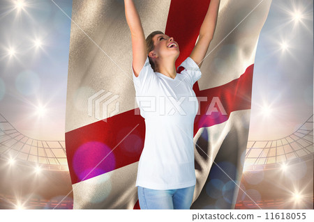 Composite image of pretty football fan in white cheering holding Composite image of pretty football fan in white cheering holding 11618055