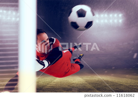 Composite image of fit goal keeper jumping up Composite image of fit goal keeper jumping up 11618062