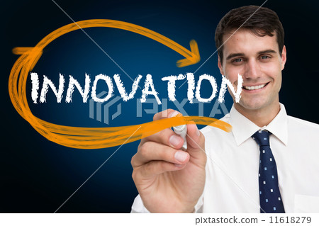 Businessman writing the word innovation 11618279
