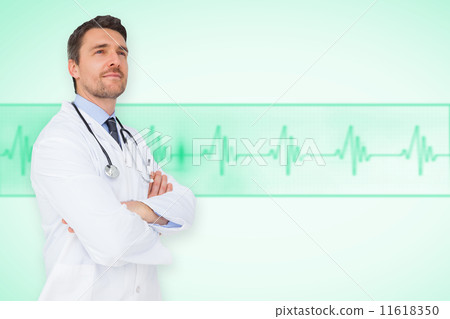 Composite image of handsome young doctor with arms crossed 11618350