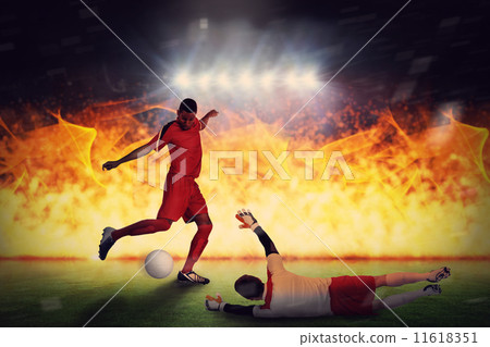 Composite image of football players tackling for the ball 11618351