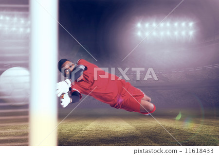 Composite image of goalkeeper in red making a save Composite image of goalkeeper in red making a save 11618433
