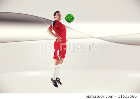 Composite image of football player in red jumping 11618560
