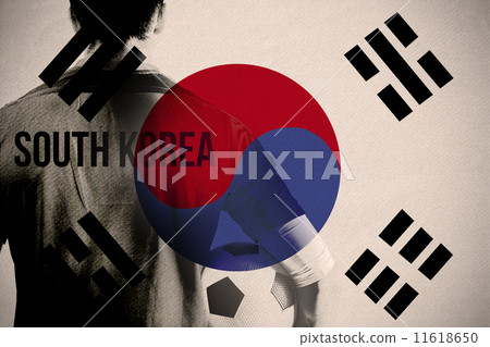 Composite image of south korea football player holding ball Composite image of south korea football player holding ball 11618650