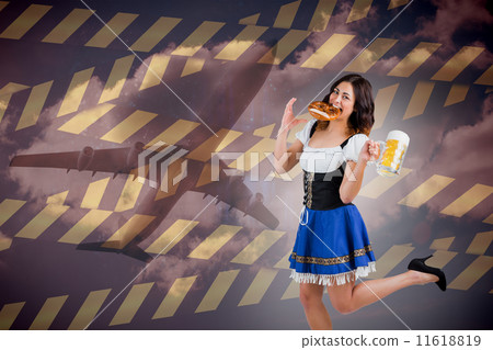 Composite image of pretty oktoberfest girl holding beer tankard 11618819