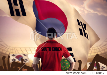 Composite image of south korea football player holding ball 11618847