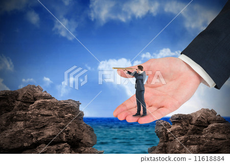 Composite image of businessman looking through telescope in larg 11618884