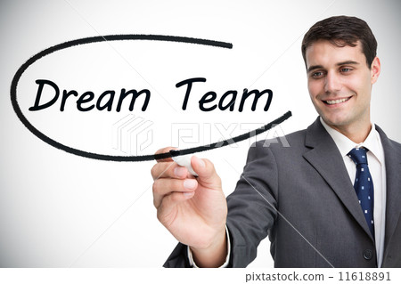 Businessman writing the words dream team 11618891