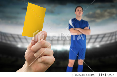 Composite image of hand holding up yellow card Composite image of hand holding up yellow card 11618892