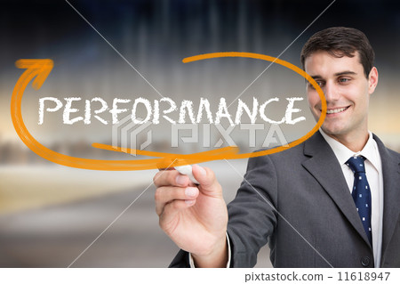 Businessman writing the word performance 11618947
