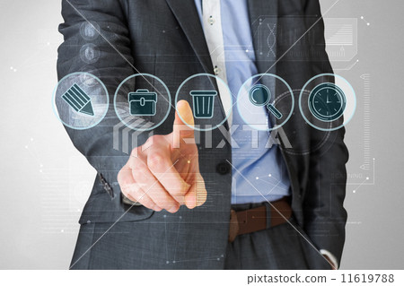 Composite image of businessman in grey suit pointing at menu 11619788