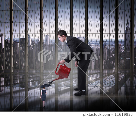 Composite image of businessman watering tiny businesswoman Composite image of businessman watering tiny businesswoman 11619853