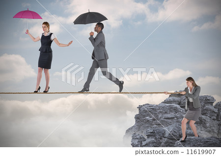 Young businesswoman pulling a tightrope for business people 11619907