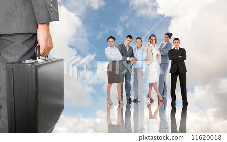 Composite image of businessman holding briefcase 11620018