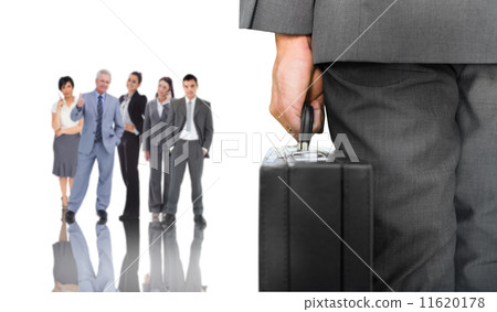 Composite image of businessman holding briefcase Composite image of businessman holding briefcase 11620178