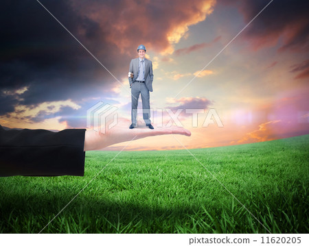 Composite image of smiling attractive architect on phone holding Composite image of smiling attractive architect on phone holding 11620205