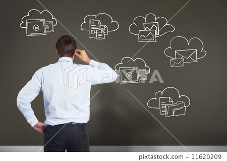 Composite image of thinking businessman tilting glasses Composite image of thinking businessman tilting glasses 11620209