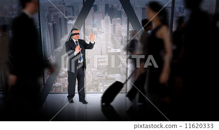 Composite image of mature businessman in a blindfold 11620333