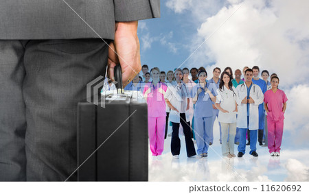Composite image of businessman holding briefcase Composite image of businessman holding briefcase 11620692