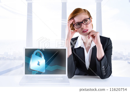 Composite image of thinking redhead businesswoman 11620754