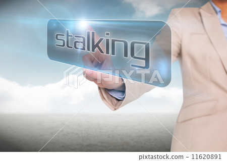 Businesswoman pointing to word stalking Businesswoman pointing to word stalking 11620891