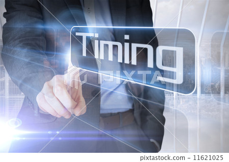 Businessman presenting the word timing 11621025