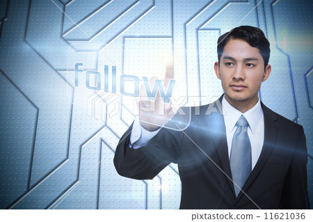 Businessman pointing to word follow 11621036